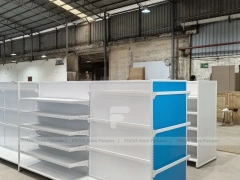 White and Blue Gondola Shelving with Layered Endcap for Beauty Store