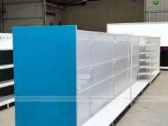 White and Blue Gondola Shelving with Layered Endcap for Beauty Store