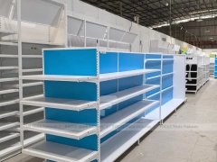 White and Blue Gondola Shelving with Layered Endcap for Beauty Store