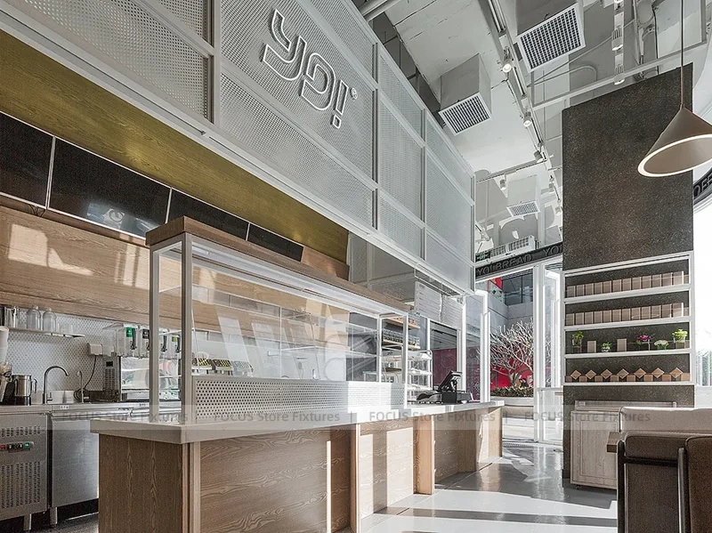 White Beverage Counter With Backlit Menu Wall