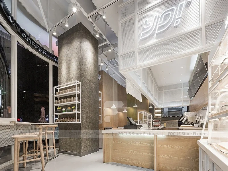 White Beverage Counter With Backlit Menu Wall