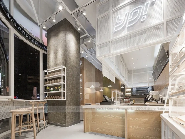 White Beverage Counter With Backlit Menu Wall