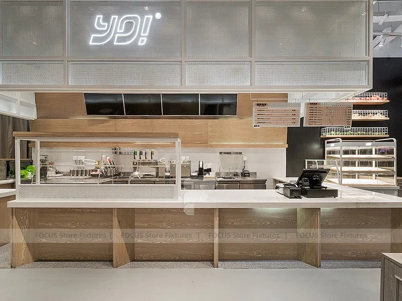 White Beverage Counter With Backlit Menu Wall