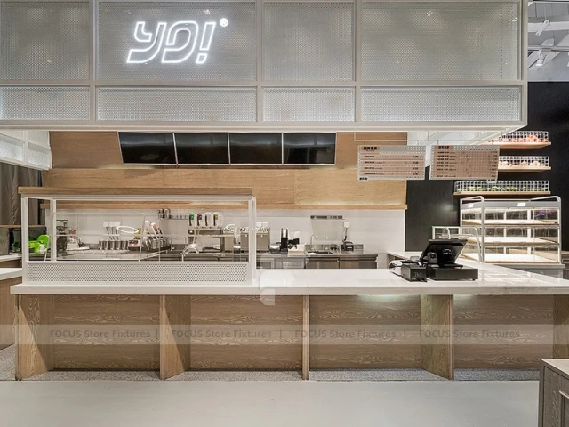 White Beverage Counter With Backlit Menu Wall