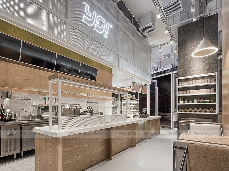 White Beverage Counter With Backlit Menu Wall