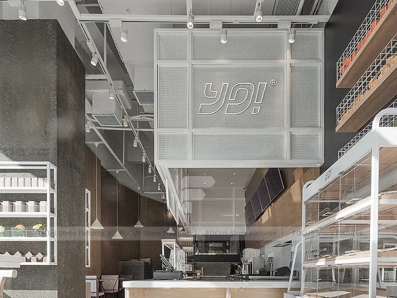 White Beverage Counter With Backlit Menu Wall