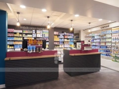 Blue Gray Pharmacy Checkout Counter and Wall Shelving
