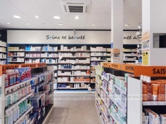 Blue White Pharmacy Aisle Shelving and Promo Gondola