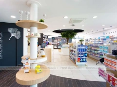 Colorful Pharmacy Wall Shelving with Round Display Table