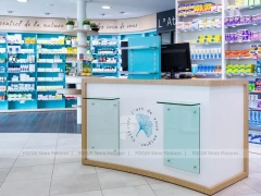 Colorful Pharmacy Wall Shelving with Round Display Table