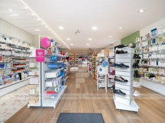 Curved Ceiling Pharmacy Counter and Wall Shelf Interior