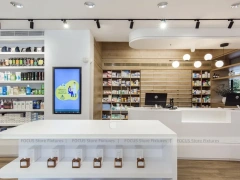 Curved White Pharmacy Counter with Wood Wall Shelving