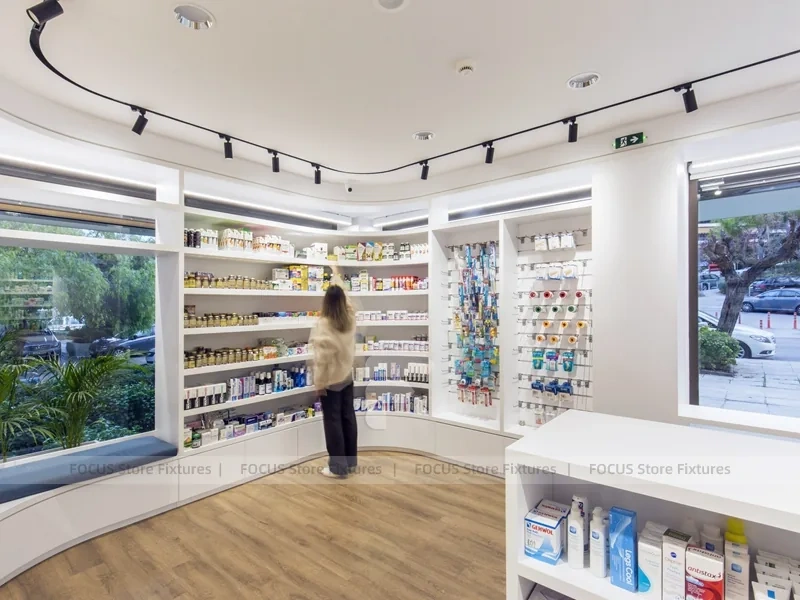 Curved White Pharmacy Counter with Wood Wall Shelving