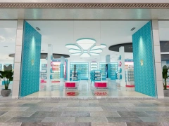 Cyan Pink Pharmacy Store Layout with Curved Wall Shelves