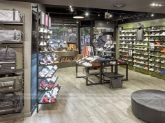 Dark Sneaker Wall Shelving and Apparel Display