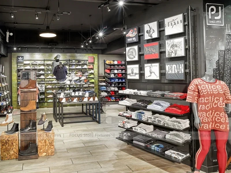 Dark Sneaker Wall Shelving and Apparel Display