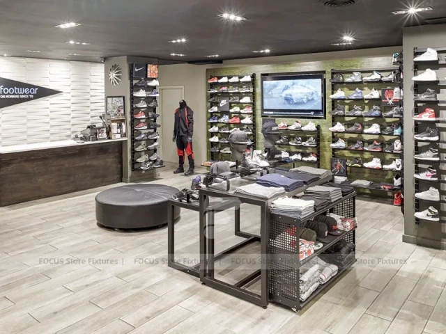 Dark Sneaker Wall Shelving and Apparel Display