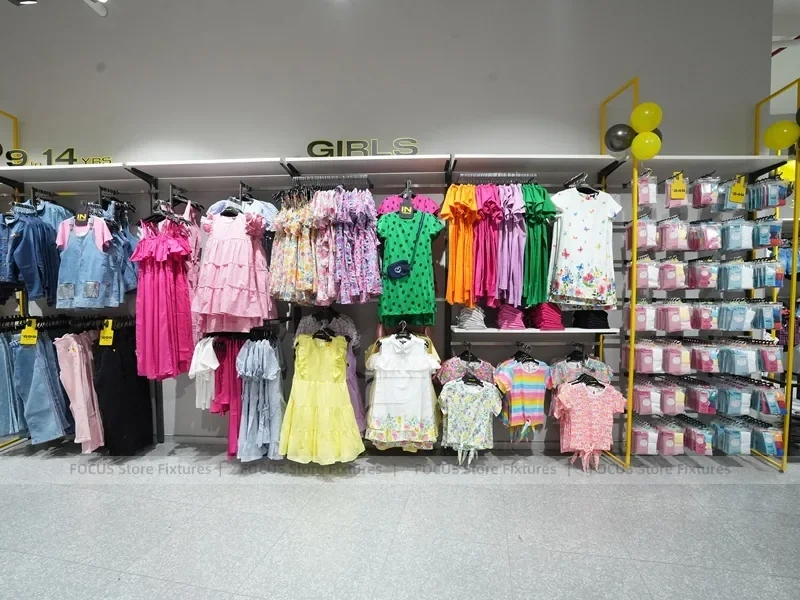 Girls Kidswear Wall Display with Colorful Dresses