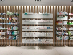 Gray White Pharmacy Counter and Illuminated Wood Shelves