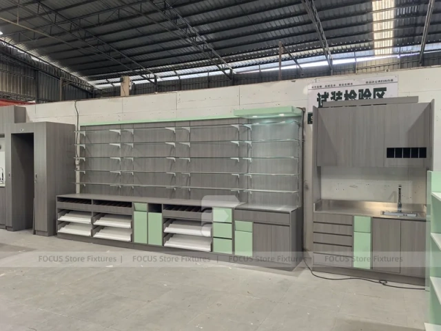 Green Accent Pharmacy Wall Shelving with Bench Displays