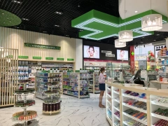 Green Cross Pharmacy Checkout and Wall Shelving Interior
