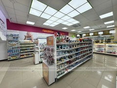 Green Cross Pharmacy Checkout and Wall Shelving Interior