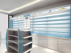 Illuminated Blue Pharmacy Wall Shelving and Counter Layout