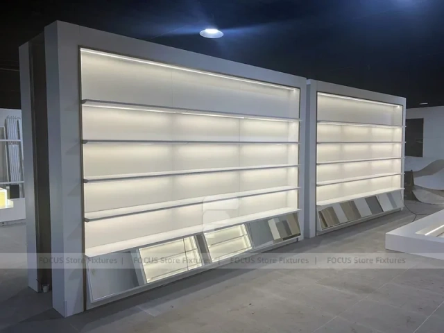 Illuminated White Wall Shelving and Checkout Display