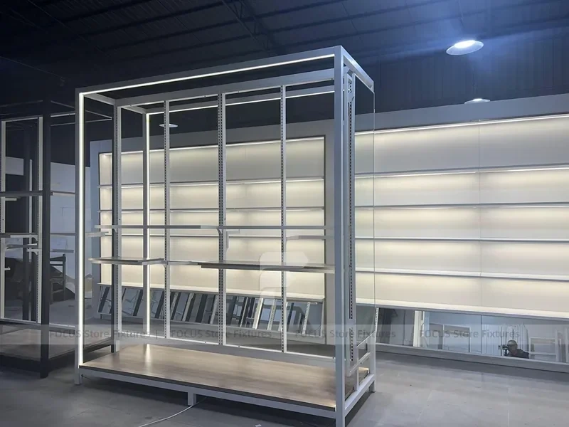 Illuminated White Wall Shelving and Checkout Display