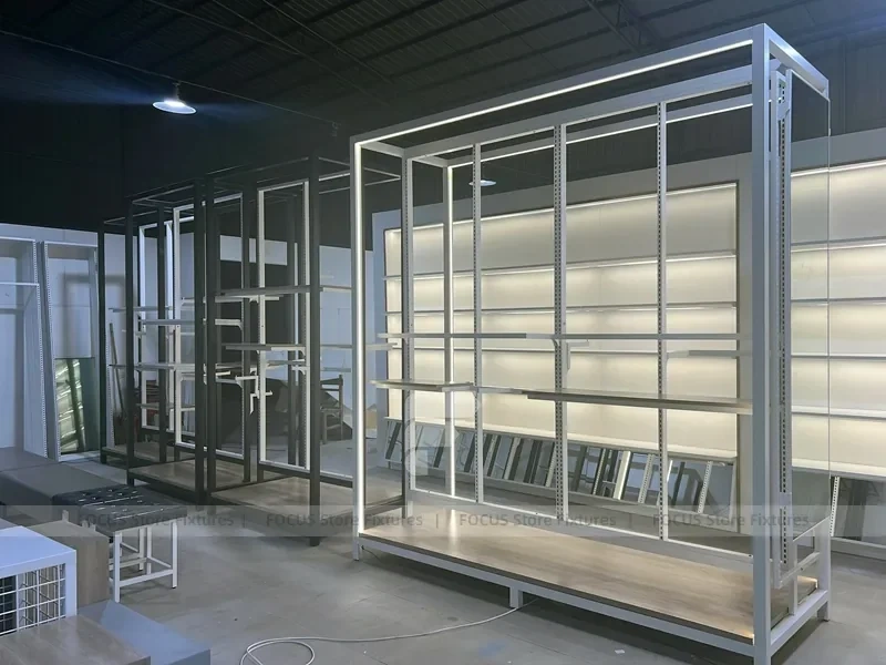 Illuminated White Wall Shelving and Checkout Display