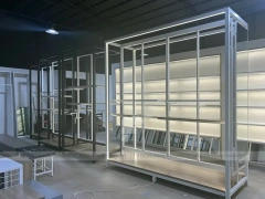 Illuminated White Wall Shelving and Checkout Display