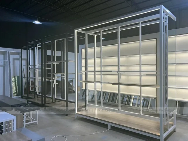 Illuminated White Wall Shelving and Checkout Display