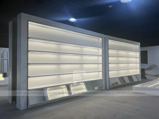 Illuminated White Wall Shelving and Checkout Display