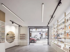 Minimal White Pharmacy Interior with Round Counter