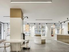 Minimal White Pharmacy Interior with Round Counter