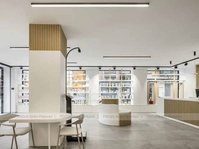 Minimal White Pharmacy Interior with Round Counter