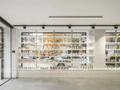 Minimal White Pharmacy Interior with Round Counter