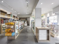 Night Facade Pharmacy Storefront with Wood Counter Interior