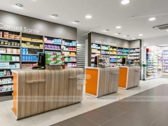 Orange Beauty Pharmacy Wall Shelving and Curved Counter