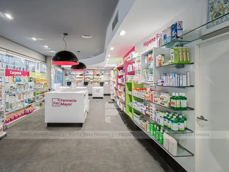 Pink Accent Pharmacy Checkout Counters and Wall Shelving