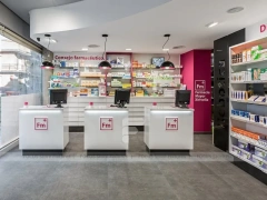 Pink Accent Pharmacy Checkout Counters and Wall Shelving