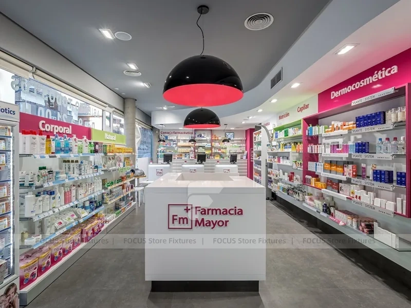 Pink Accent Pharmacy Checkout Counters and Wall Shelving