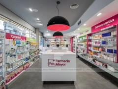 Pink Accent Pharmacy Checkout Counters and Wall Shelving