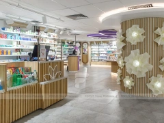 Purple Accent Pharmacy Wall Shelving with Floral Partitions