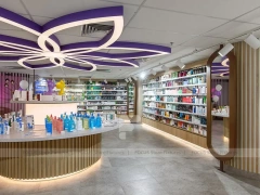 Purple Accent Pharmacy Wall Shelving with Floral Partitions