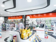 Red Accent Pharmacy Gondola and Curved Checkout Counter