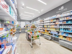 Rounded Corner Pharmacy Wall Shelving Interior