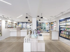 White Industrial Pharmacy Shelving with Mesh Gondola Tables