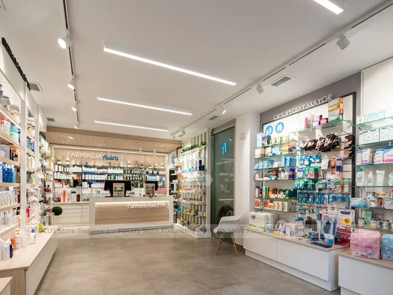 White Linear Pharmacy Aisle Shelving and Back Counter
