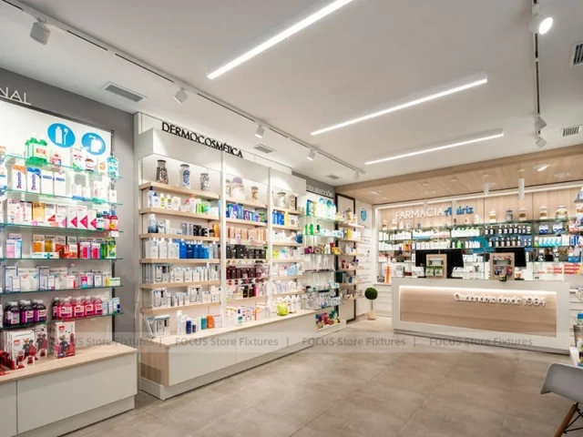 White Linear Pharmacy Aisle Shelving and Back Counter